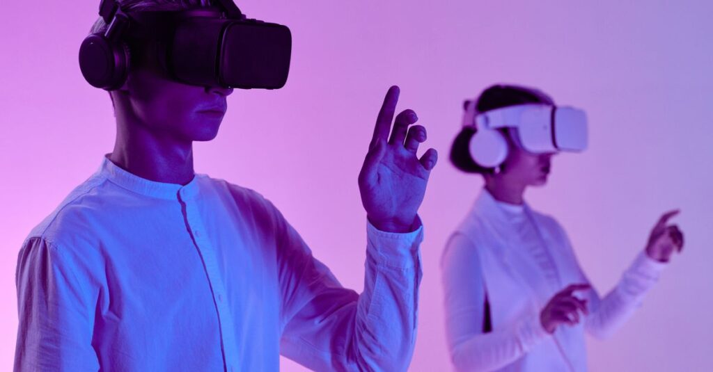 Two people engage in a futuristic virtual reality simulation with headsets and vibrant lighting.